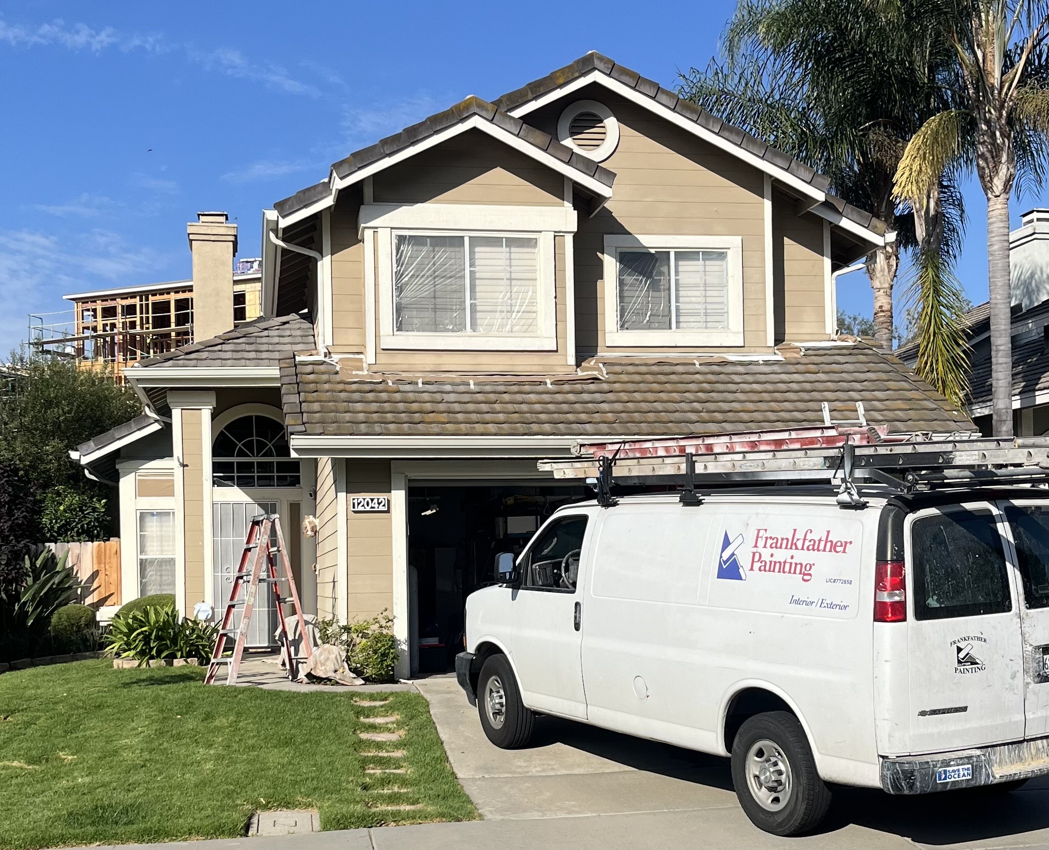A White Van Is Parked in Front of a House