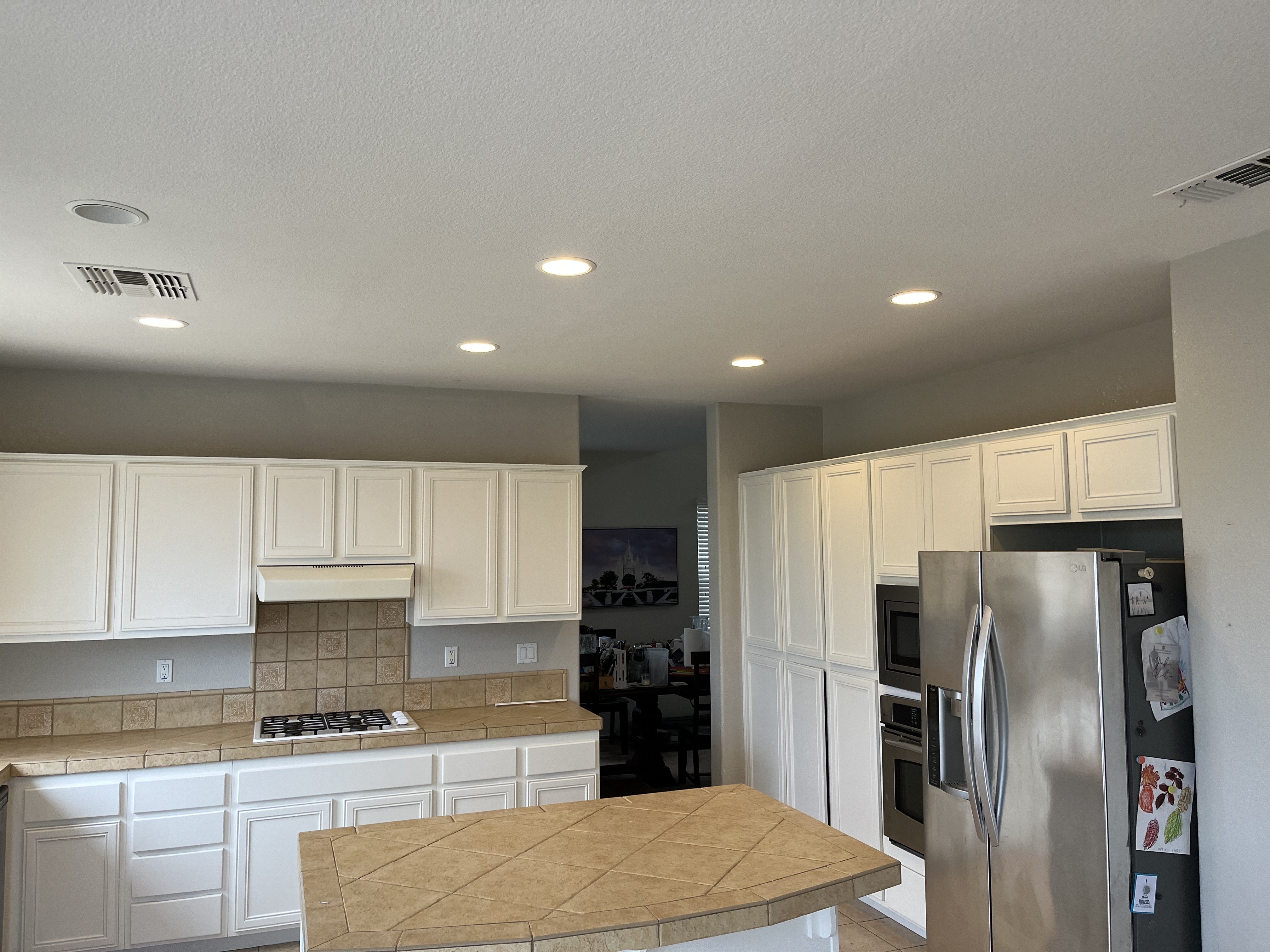 A Bright Kitchen Featuring a Clean Counter and a Shiny Sink 2
