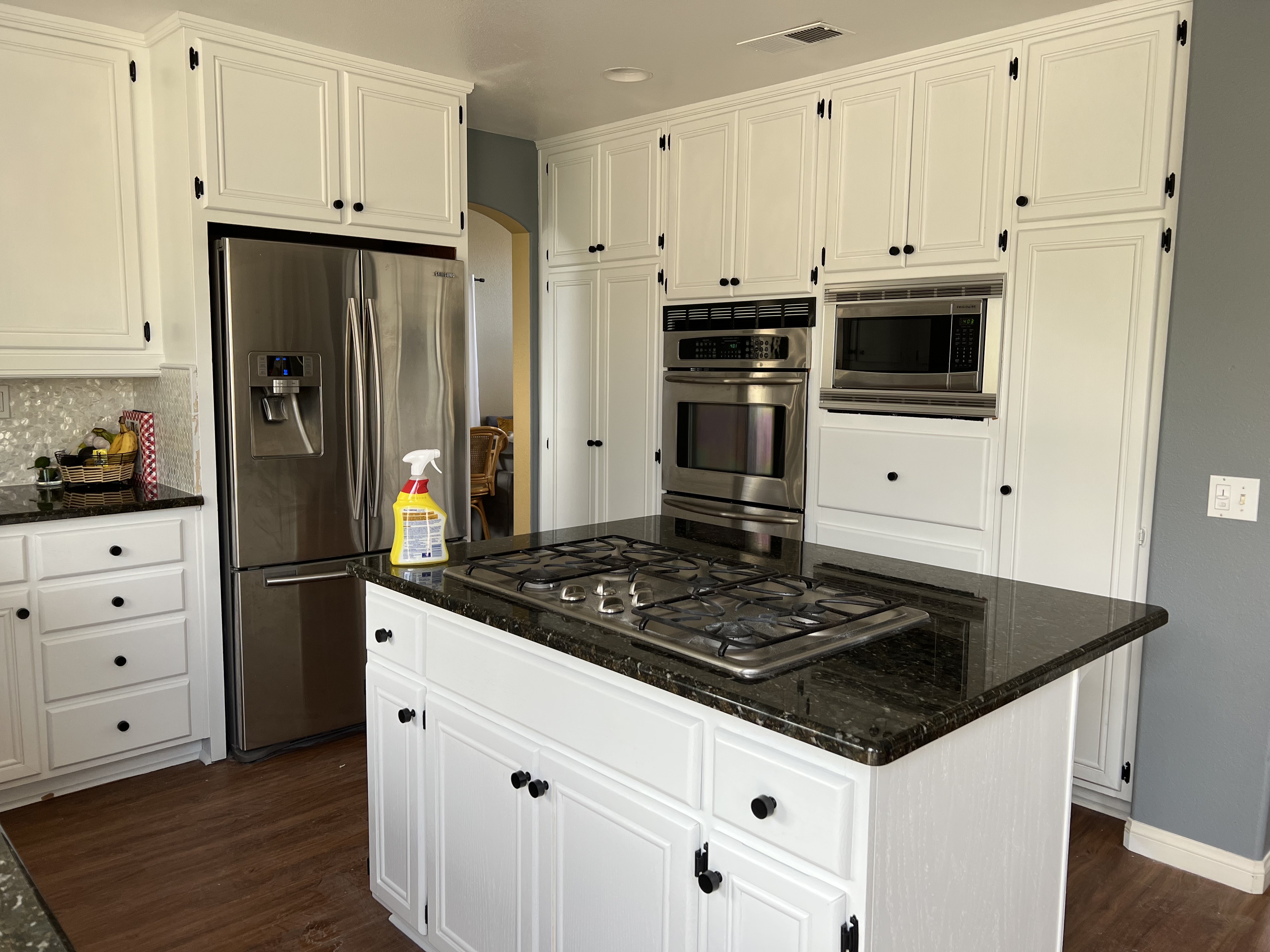 A Bright Kitchen Featuring a Clean Counter and a Shiny Sink 3
