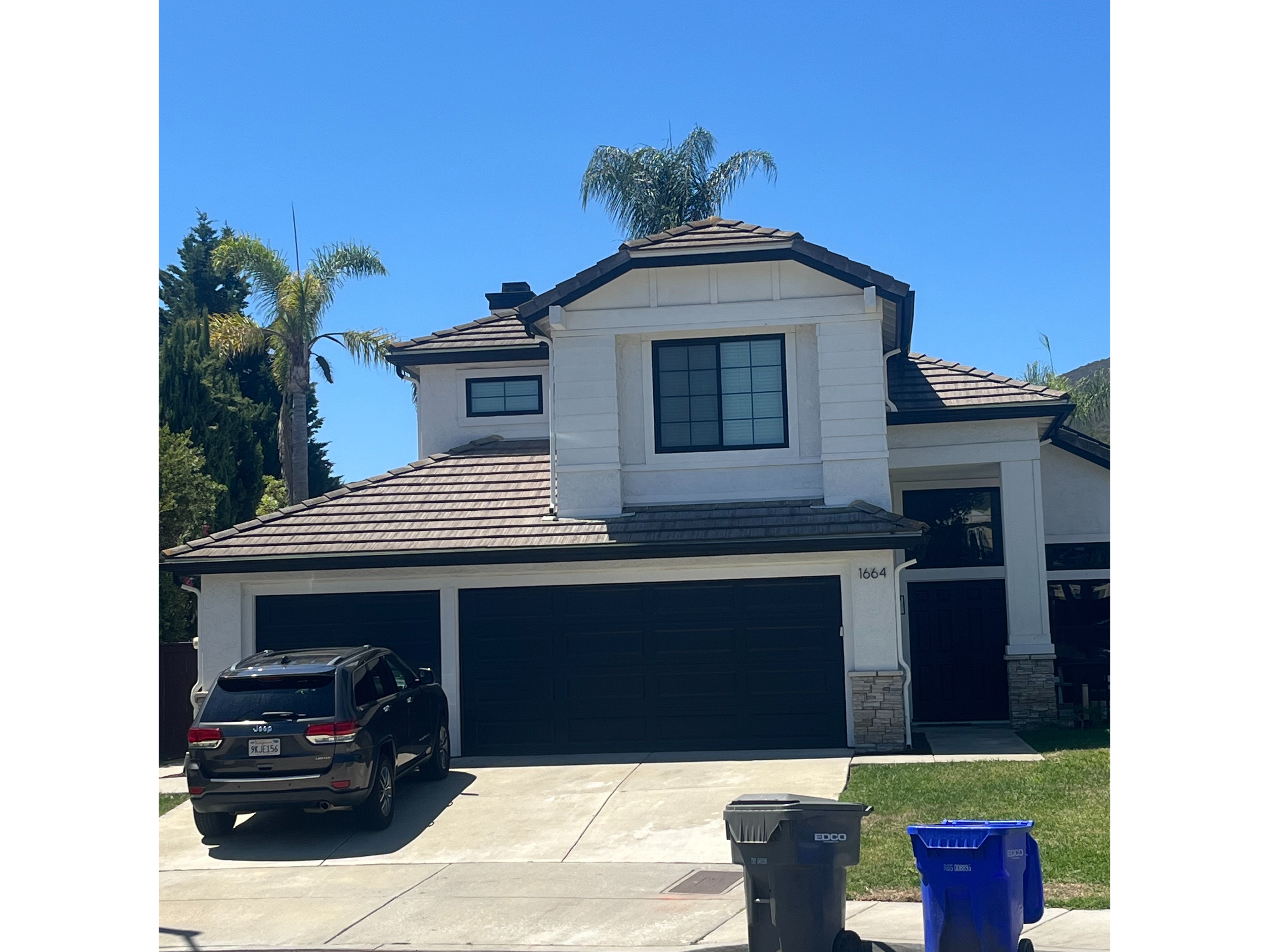 A House With a Car Parked in Front